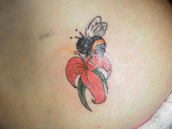 Cool Bumblebee On Flower Tattoo Design For Lower Back
