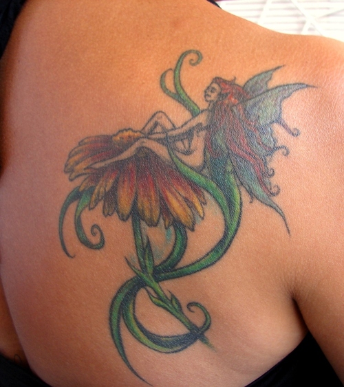 Cool Fairy On Flower Tattoo On Girl Right Back Shoulder