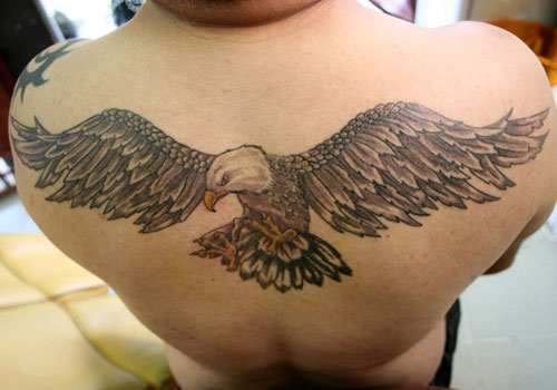 Cool Flying Eagle Tattoo On Man Upper Back