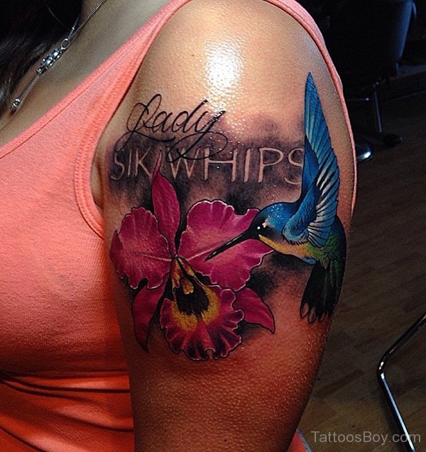 Cool Lily Flower With Flying Bird Tattoo On Women Left Shoulder