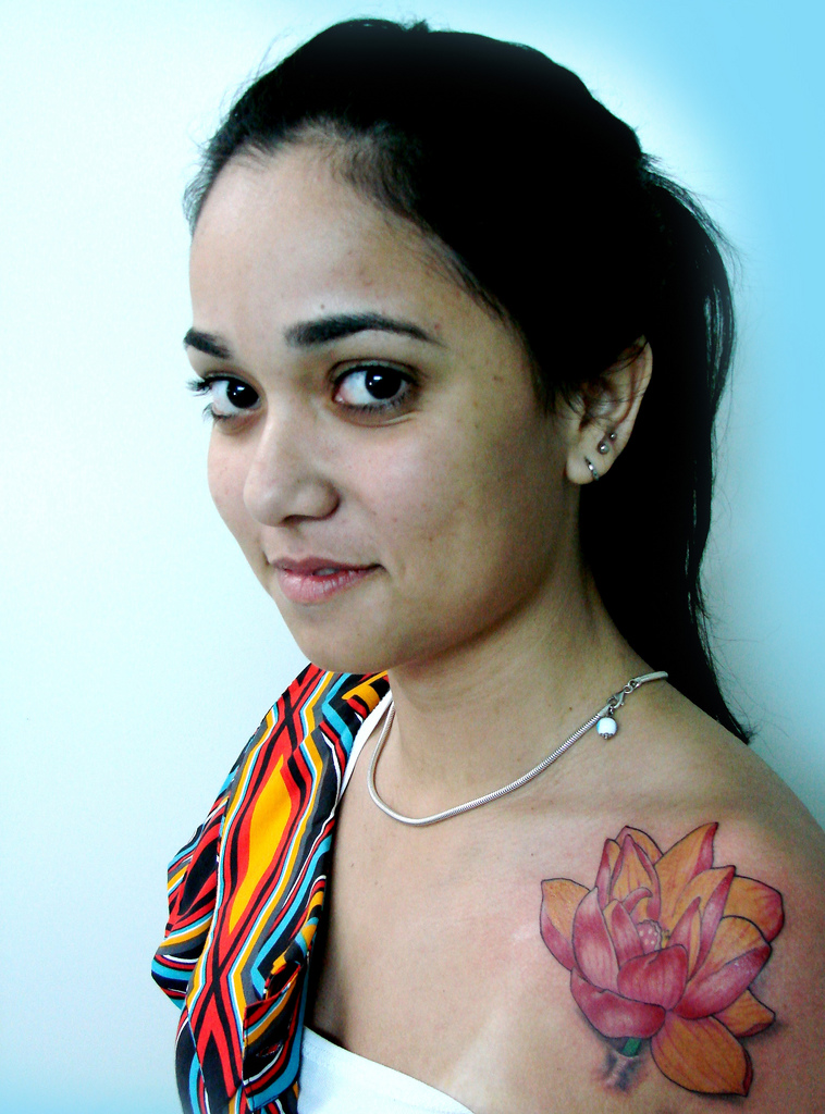 Cool Lotus Tattoo On Girl Left Front Shoulder