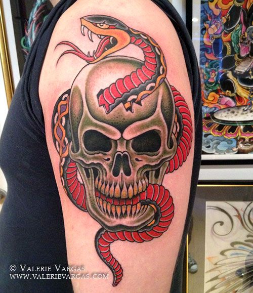 Cool Traditional Snake In Skull Tattoo On Left Shoulder