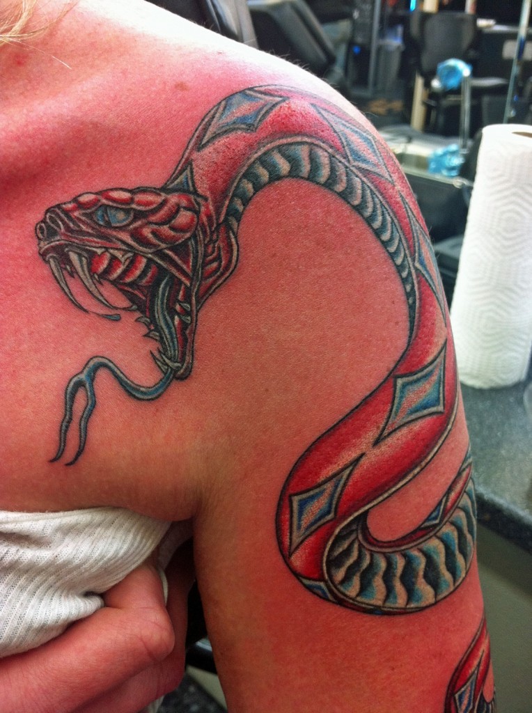 Cool Traditional Snake Tattoo On Women Left Upper Arm