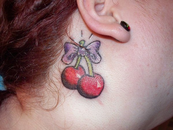 Cute Bow With Cherry Tattoo On Side Neck