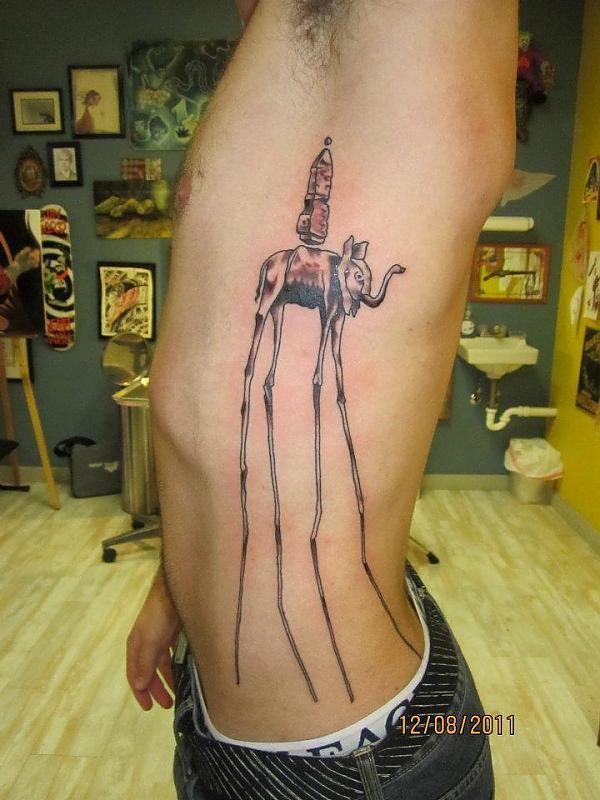 Dali Elephant Tattoo On Man Left Side Rib
