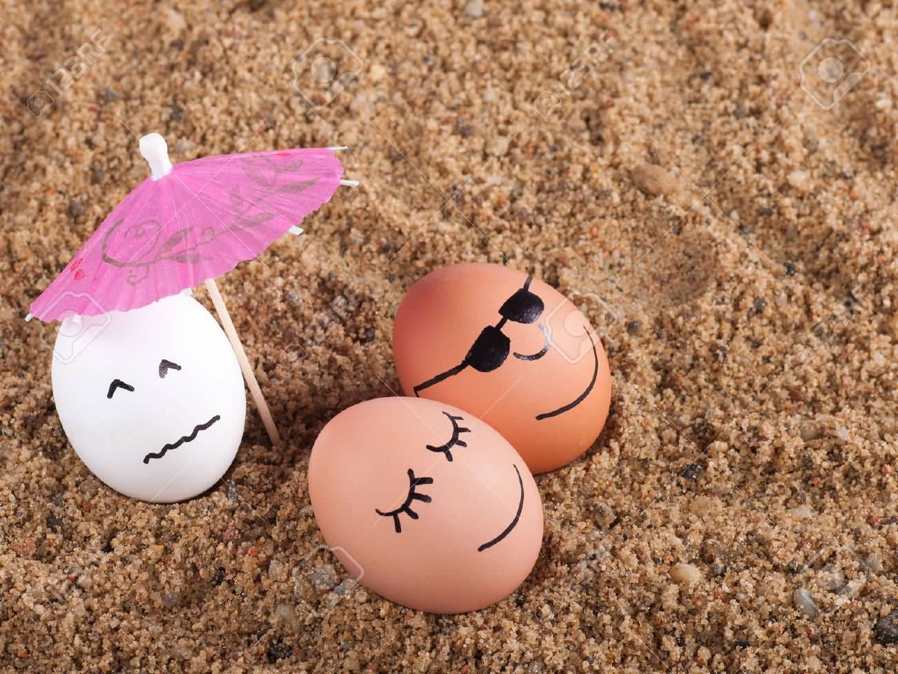 Eggs Relaxing Under Umrella On Beach Sand Funny Picture