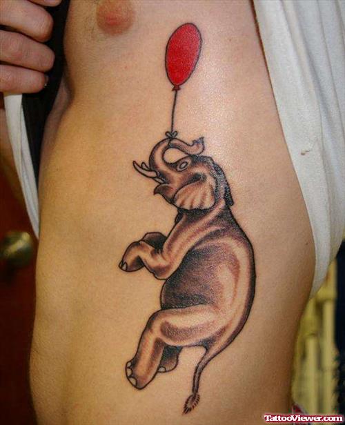 Elephant Trunk Up With Balloon Tattoo On Left Side Rib