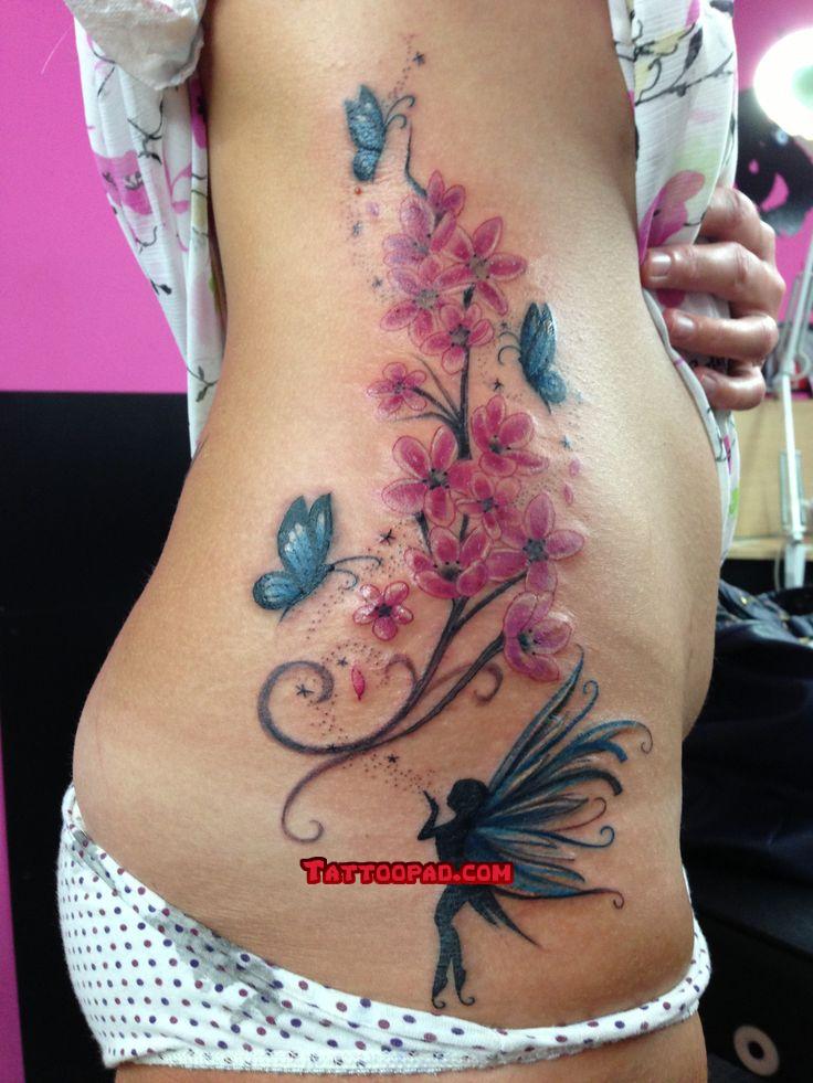 Fairy With Flying Butterflies With Flowers Tattoo On Right Side Rib