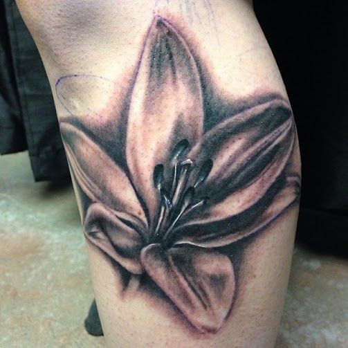Fantastic Black And Grey Lily Tattoo On Leg