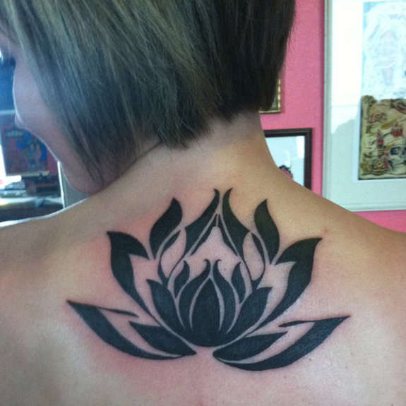 Fantastic Black Ink Lotus Flower Tattoo On Girl Back Neck