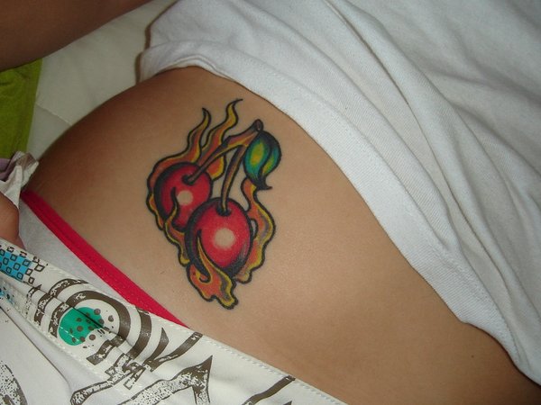 Flaming Cherry Tattoo On Girl Right Hip