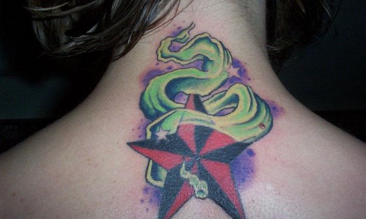 Flaming Nautical Star Tattoo On Upper Back