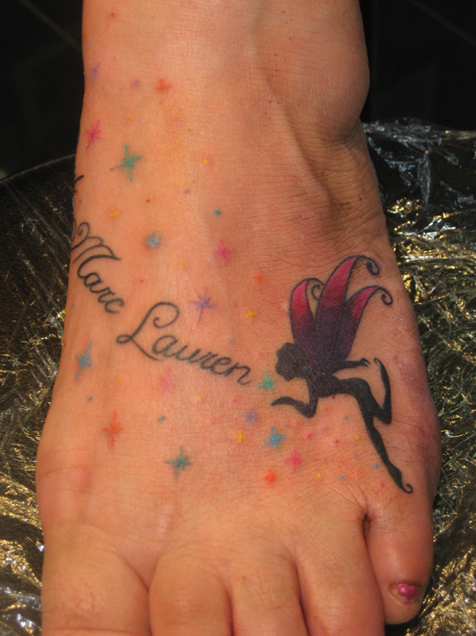 Flying Fairy With Fairy Dust Tattoo On Girl Left Foot