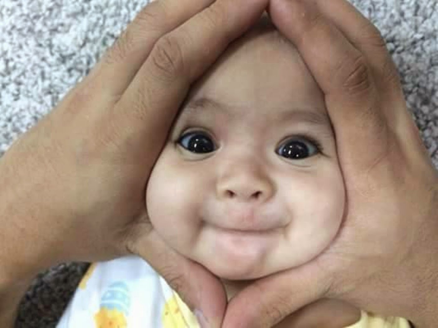 Funny Baby Face In Hand Palms