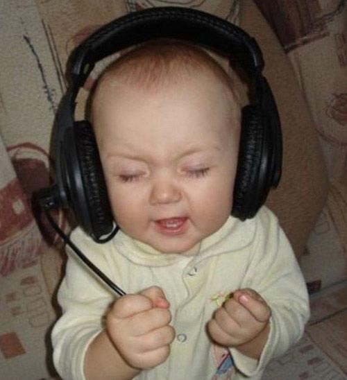 Funny Baby Reacting On Listening Music On Headphones Picture