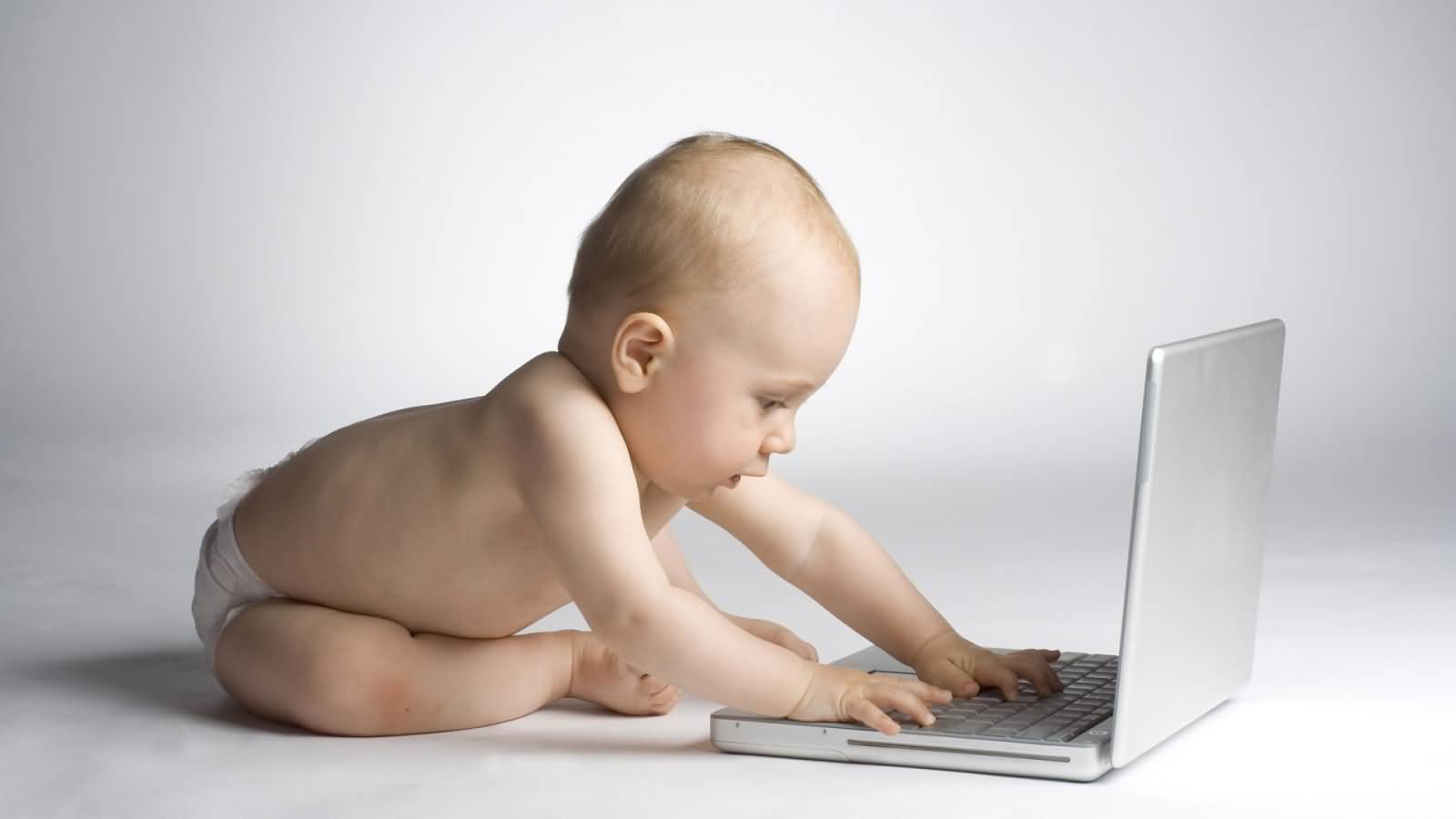 Funny Baby Working On Laptop