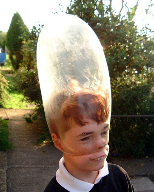 Funny Kid Wearing Balloon On Face
