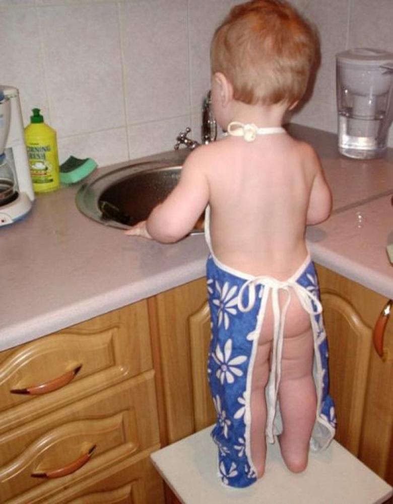 Funny Kid Wearing Nothing But An Apron