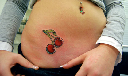 Girl Showing Her Cherry Tattoo On Hip