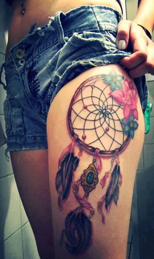 Girl Showing Her Colorful Dreamcatcher Tattoo On Thigh
