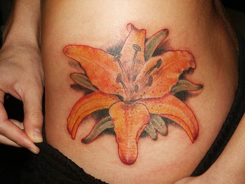 Girl Showing Her Tiger Lily Tattoo