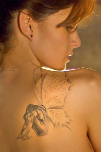 Grey Ink Fairy Tattoo On Girl Right Back Shoulder