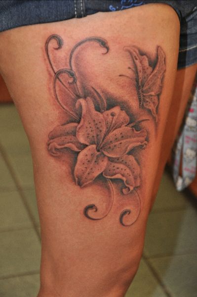 Grey Ink Lily Flower With Butterfly Tattoo On Right Side Thigh