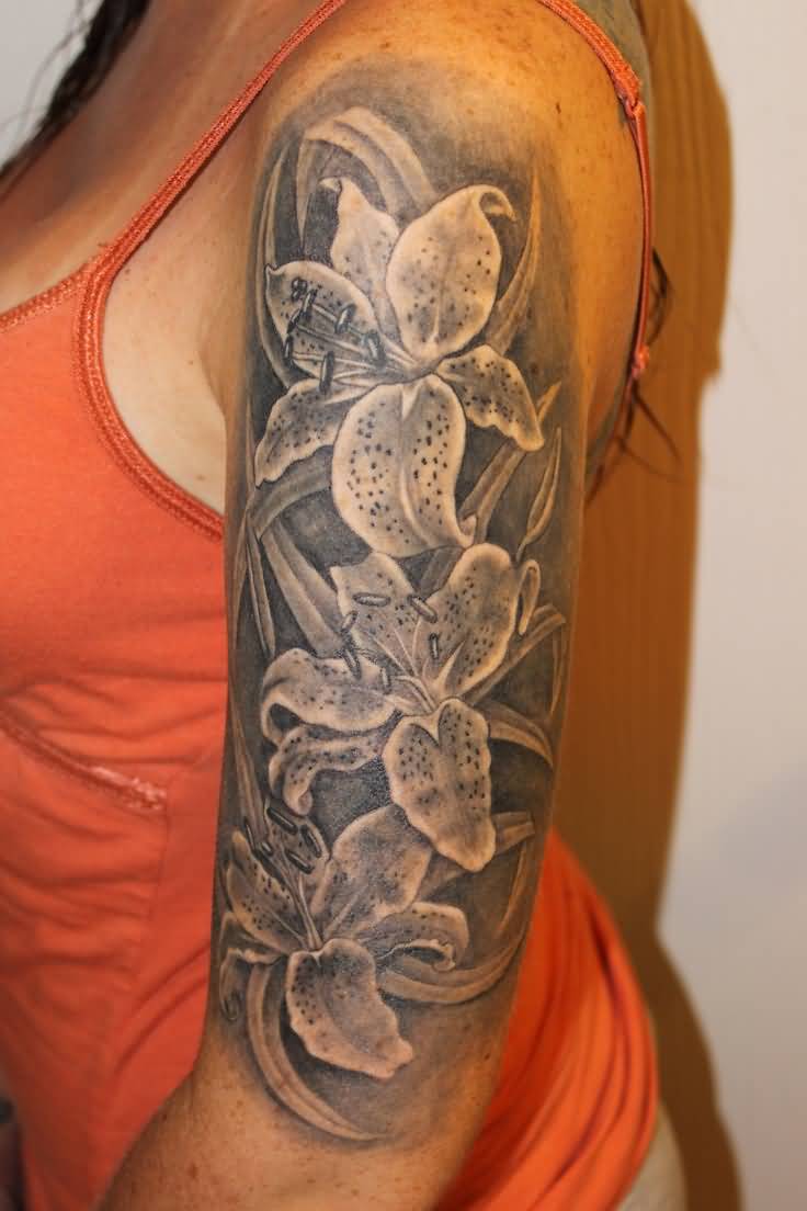 Grey Ink Lily Flowers Tattoo On Women Left Upper Arm