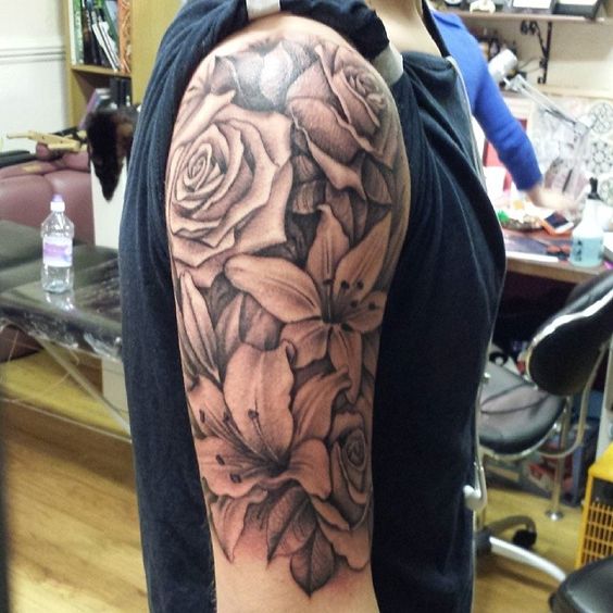 Grey Rose Flowers And Lily Tattoos On Half Sleeve