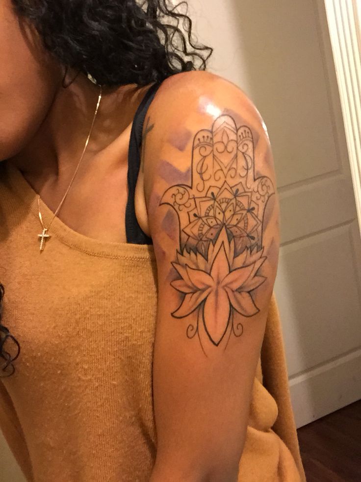 Hamsa Hand With Lotus Flower Tattoo On Girl Left Upper Arm