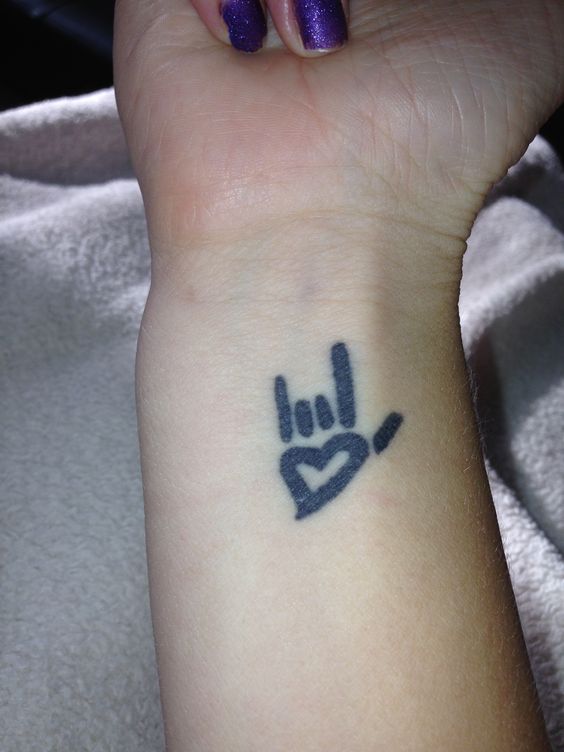 I Love You Sign Tattoo On Girl Right Wrist