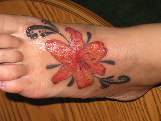 Inspiring Lily Flower Tattoo On Left Foot