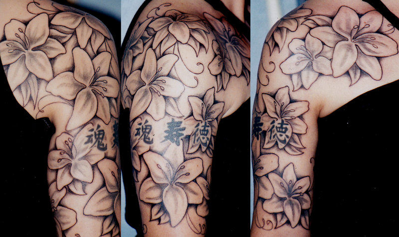 Kanji Symbols And Lily Flowers Tattoo On Half Sleeve