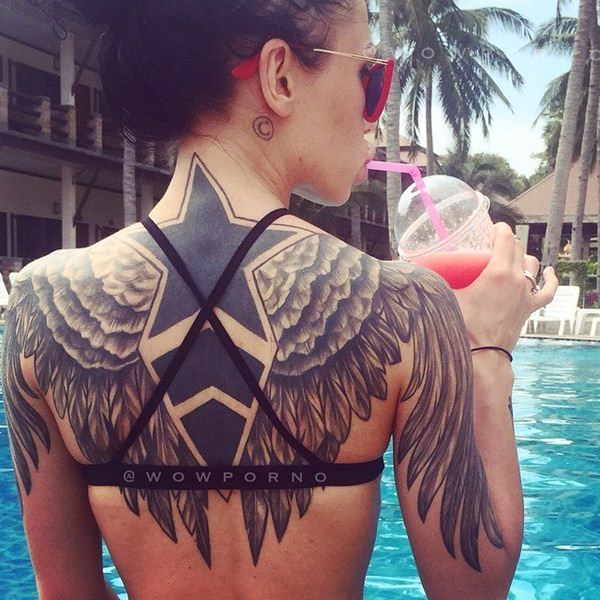 Large Angel Wings And Star Tattoos On Girl Back