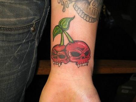 Left Wrist Cherry Skull Tattoo