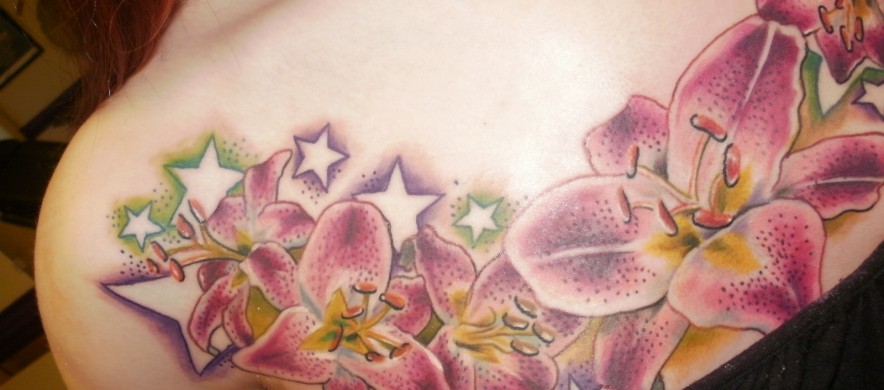 Lily Flowers And Stars Tattoo On Girl Front Shoulder