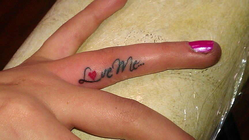 Love Me Tattoo On Girl Side Finger