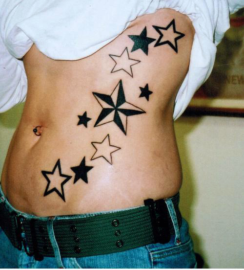 Nautical Star And Outline Star Tattoos On Stomach