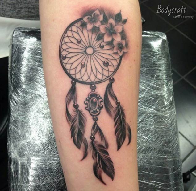 Nice Grey Flowers And Dreamcatcher Tattoo On Arm