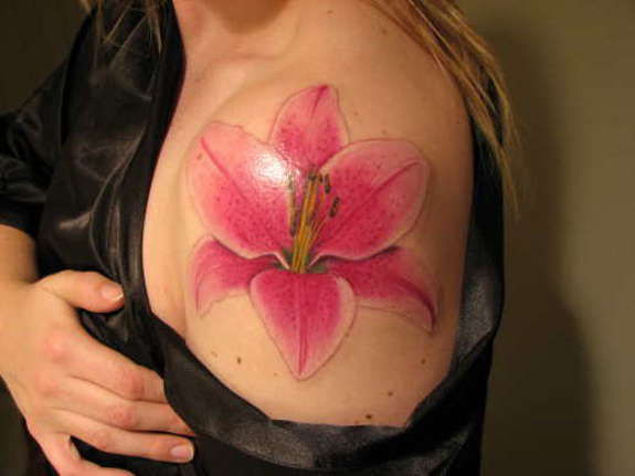 Nice Pink Lily Flower Tattoo On Left Shoulder