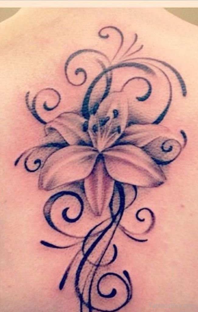 Nice Tribal Lily Flower Tattoo On Upper Back
