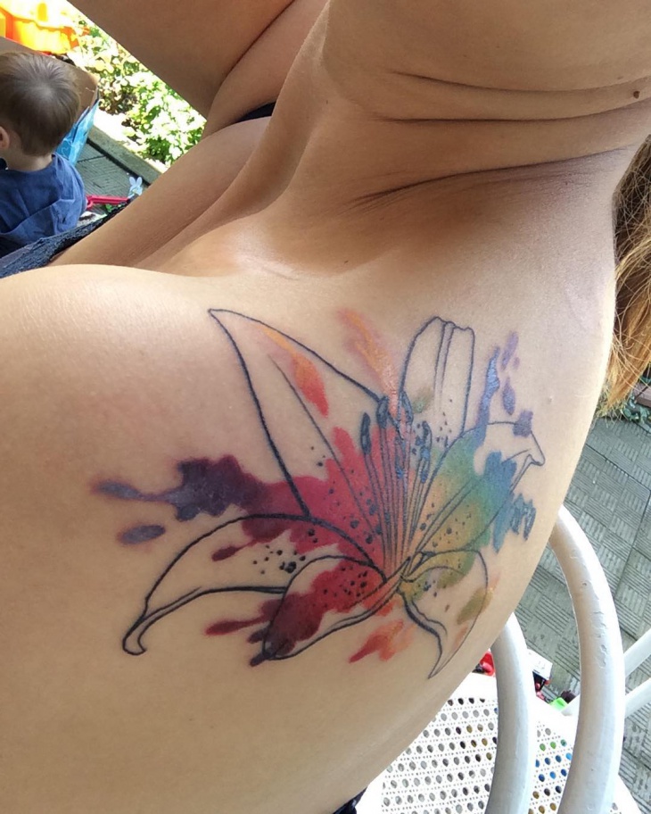 Nice Watercolor Lily Tattoo On Left Back Shoulder