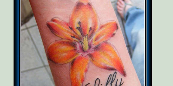 Orange Ink Lily Flower Tattoo Design For Wrist