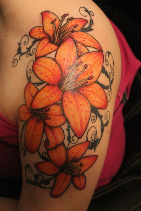 Orange Ink Lily Flowers Tattoo On Women Left Upper Arm