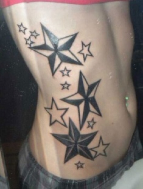 Outline And Black Nautical Star Tattoos On Side Rib
