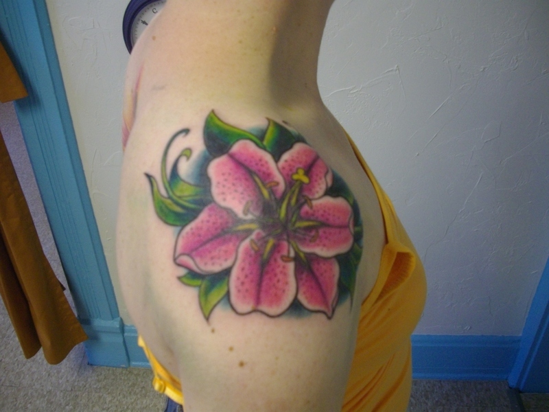 Pink Ink Flower Tattoo On Girl Right Shoulder