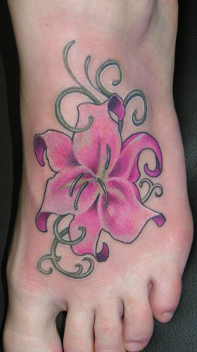 Pink Ink Lily Flower Tattoo On Left Foot