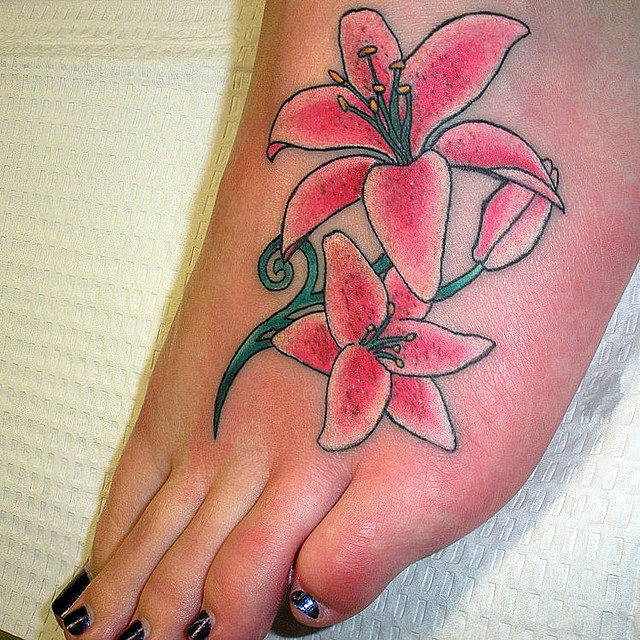 Pink Ink Lily Flowers Tattoo On Girl Left Foot