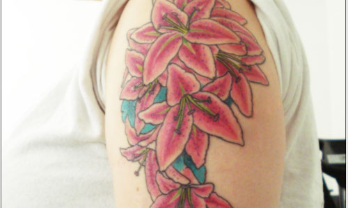Pink Ink Lily Flowers Tattoo On Right Upper Arm