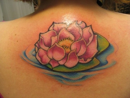 Pink Ink Lotus Flower In Water Tattoo On Girl Upper Back